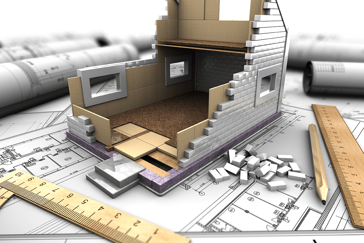 a sketch with a ruler and a model of a house