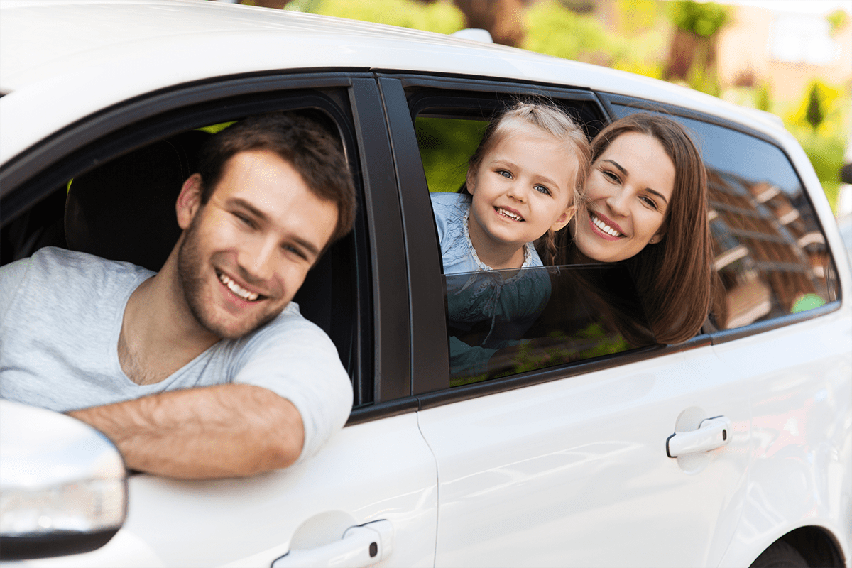 Family looking out of car windows