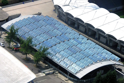 S.O.L.I.D. Gesellschaft für Solarinstallation und Design mbH Production hall from outside in aerial perspective.